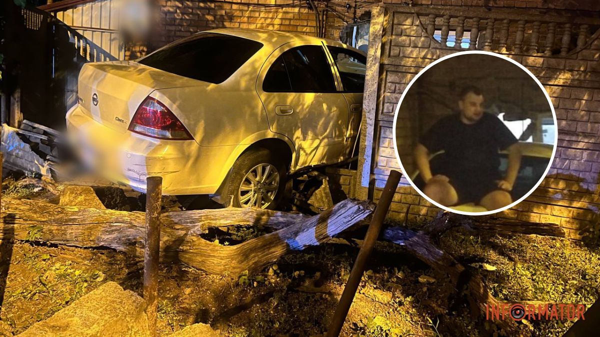У Дніпрі нетверезий водій Nissan в’їхав у паркан і приватний будинок: спроби знову потрапити в авто закінчились падінням на камеру