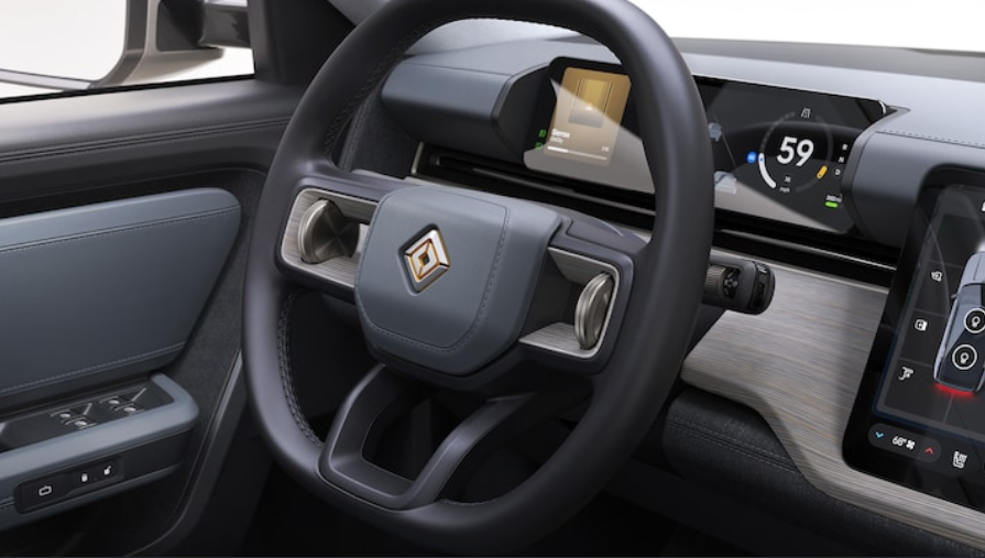 Рульове колесо має два великі вертикально орієнтовані важелі, які працюють як кнопки "джойстика" Рульове колесо має два великі вертикально орієнтовані важелі, які працюють як кнопки "джойстика"