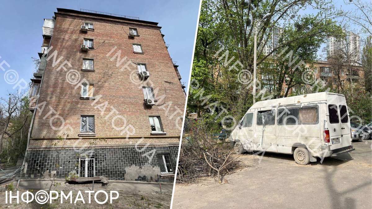 Шибки п'ятиповерхівки закриті пластиком та плитами ДВП, а у дворі стоять посічені автівки
