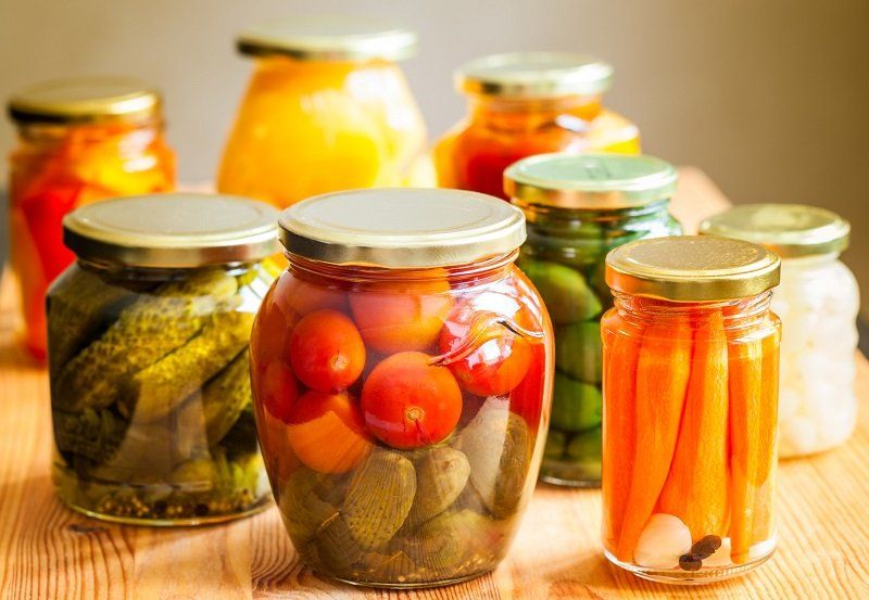 Vegetable preserves on wooden table