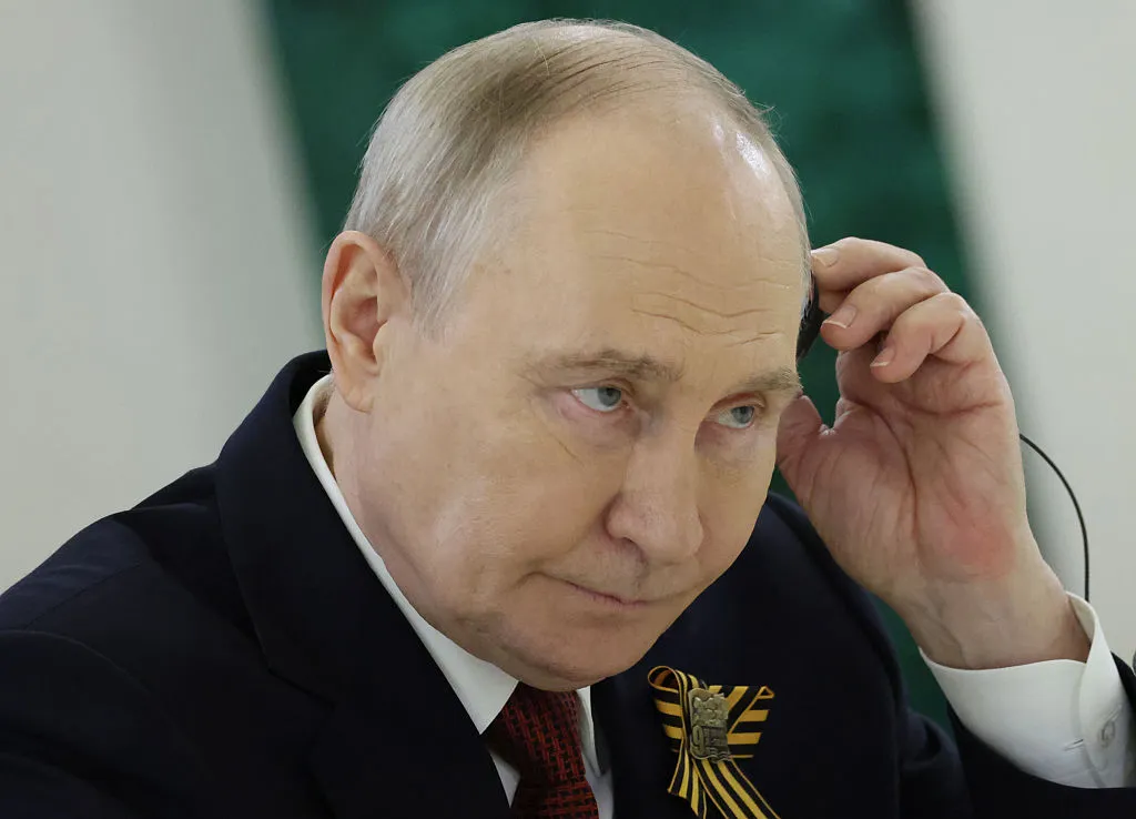 Путин