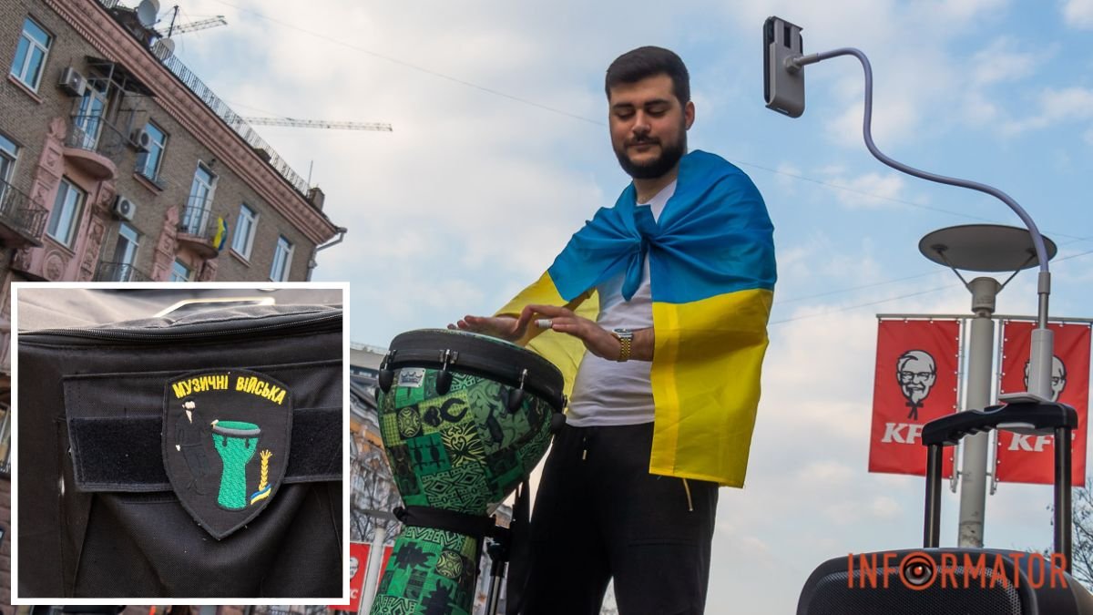 Музика, що підбадьорює: у центрі Дніпра огорнутий у жовто-блакитний прапор переселенець грає на барабані