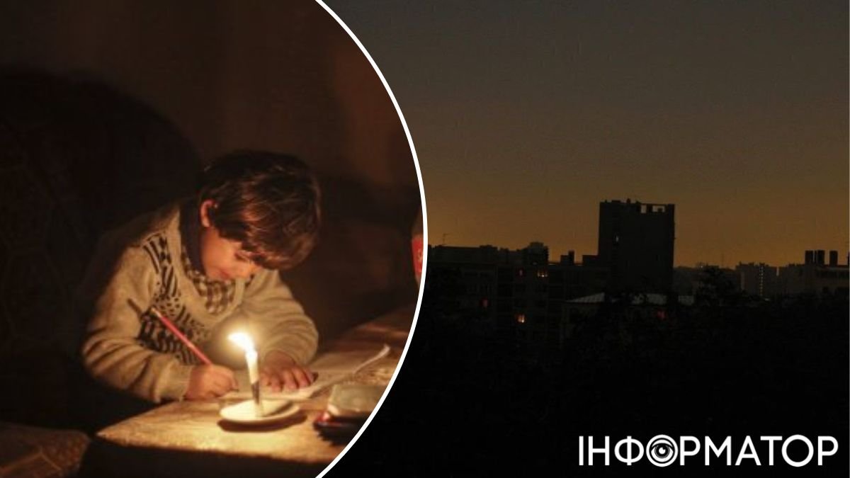 ребенок пишет при свече в темноте, темный город